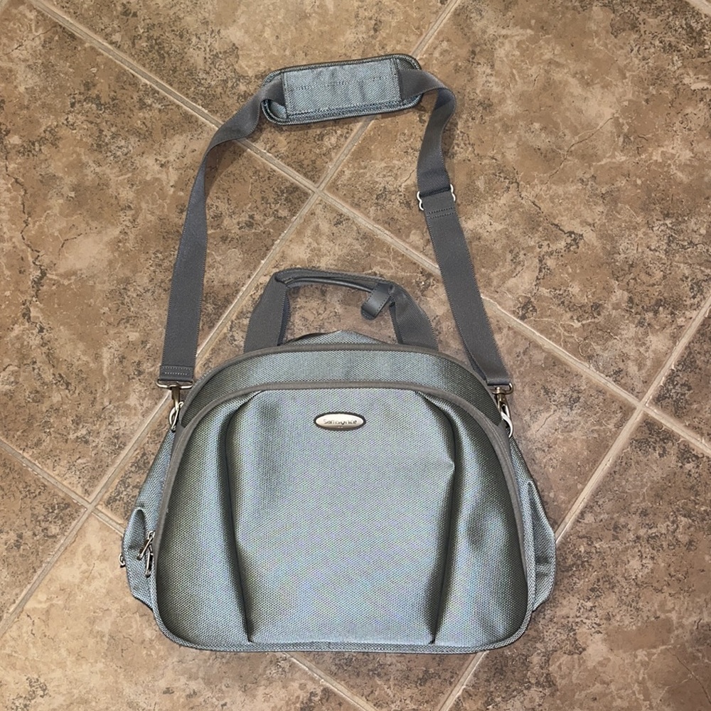 Silver Samsonite carry on bag